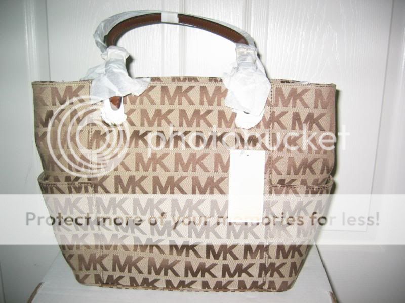   is a Brand New with Tag Authentic MICHAEL KORS SIGNATURE TOTE HANDBAG